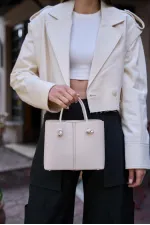 Sac à main et sac à bandoulière crème avec détails en dentelle Sac à main et sac à bandoulière crème avec détails en dentelle