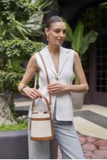 Sac seau en toile beige à main et à bandoulière avec coutures contrastées