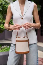 Sac seau en toile beige à main et à bandoulière avec coutures contrastées
