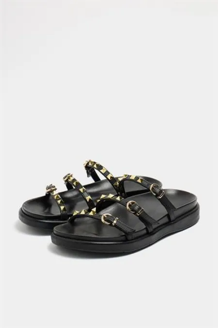 Chaussons tendance noirs avec détails cloutés dorés