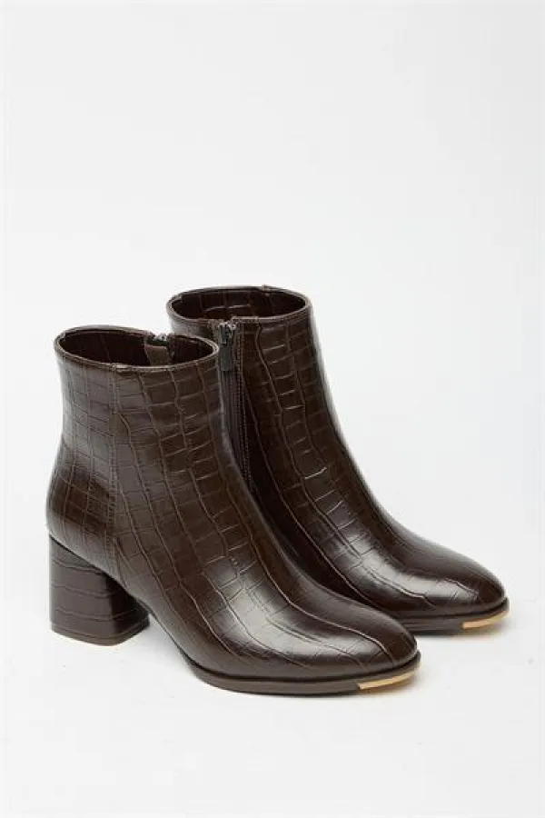 Bottes et bottines en crocodile marron