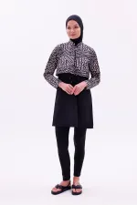 Maillot de bain une pièce imperméable de type parachute, avec leggings et double bonnet.