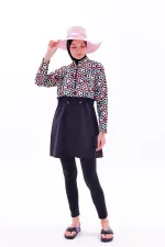 Maillot de bain une pièce imperméable de type parachute, avec leggings et double bonnet.