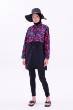 Maillot de bain une pièce imperméable de type parachute, avec leggings et double bonnet.