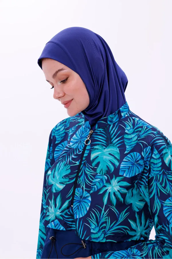 Maillot de bain une pièce imperméable de type parachute, avec leggings et double bonnet.