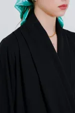 Chemisier drapé en satin noir à col cache-cœur pour femme 0492