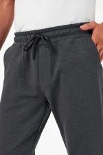 Pantalon de jogging épais anthracite pour homme, avec poches arrière, chevilles élastiques, coupe classique, sans armature.