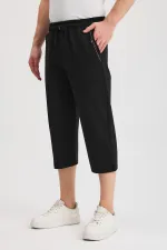 Short bermuda noir pour homme, longueur genou, style capri, avec poches latérales et taille élastique ajustable MTLCE108