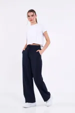 Pantalon de survêtement ample et confortable pour femme, idéal pour la saison, avec poches latérales, noir.