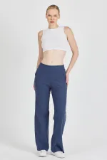 Pantalon de survêtement indigo côtelé à jambes larges et taille haute avec poches pour femme