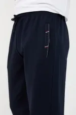 Men's Black and Navy Blue Sweatpants with Two Zipper Pockets, Embroidered Detail, Straight Leg, and Relaxed Fit.