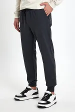 Pantalon de survêtement noir et gris pour homme, coupe classique, avec étiquette sur la poche arrière et ourlets élastiques (lot de 2)