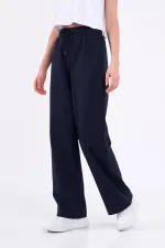 Pantalon de survêtement ample et confortable pour femme, idéal pour la saison, avec poches latérales, noir.