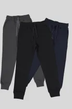 Lot de 3 pantalons de survêtement pour filles en coton épais, coloris noir, marine et anthracite, avec taille et chevilles élastiques et poches.