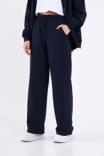 Pantalon de survêtement ample et confortable pour femme, idéal pour la saison, avec poches latérales, noir.