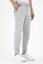 Pantalon de survêtement gris pour homme avec étiquette, poches arrière et latérales, coupe classique, taille élastique