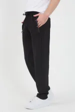 Men's Black and Navy Blue Sweatpants with Two Zipper Pockets, Embroidered Detail, Straight Leg, and Relaxed Fit.