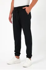 Lot de 3 pantalons de jogging épais pour homme (noir, marine et anthracite), avec poches arrière, chevilles élastiques, coupe classique, sans armature.