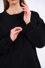 Sweat-shirt basique oversize en coton noir pour femme, col rond.