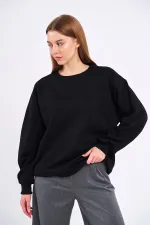 Sweat-shirt basique oversize en coton noir pour femme, col rond.