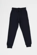 Lot de 4 bas de survêtement pour garçon en coton épais, taille élastique et poches sur les jambes, coloris noir, bleu marine, anthracite et gris.