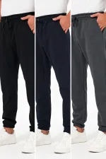 Lot de 3 pantalons de jogging épais pour homme (noir, marine et anthracite), avec poches arrière, chevilles élastiques, coupe classique, sans armature.
