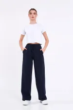 Pantalon de survêtement ample et confortable pour femme, idéal pour la saison, avec poches latérales, noir.