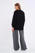 Sweat-shirt basique oversize en coton noir pour femme, col rond.