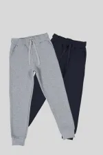 Ensemble de 2 pantalons de survêtement pour filles en coton épais noir et anthracite, avec taille et chevilles élastiques et poches.