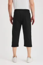 Short bermuda noir pour homme, longueur genou, style capri, avec poches latérales et taille élastique ajustable MTLCE108