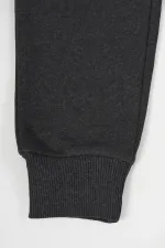 Pantalon de survêtement en coton épais anthracite avec taille et chevilles élastiques, pour filles de 5 à 12 ans.