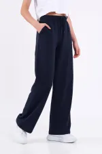Pantalon de survêtement ample et confortable pour femme, idéal pour la saison, avec poches latérales, noir.