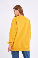 Sweat-shirt basique oversize en coton jaune pour femme, col rond.