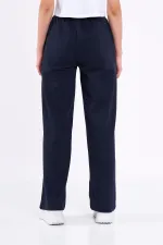Pantalon de survêtement ample et confortable pour femme, idéal pour la saison, avec poches latérales, noir.