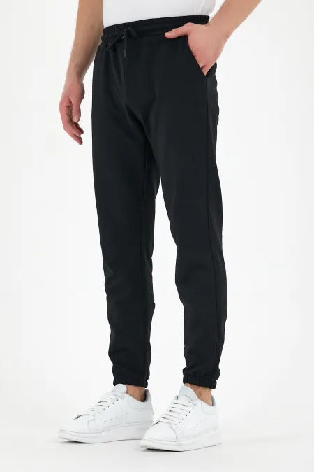 Pantalon de survêtement noir pour homme avec étiquette, poches arrière et latérales, coupe classique, taille élastique