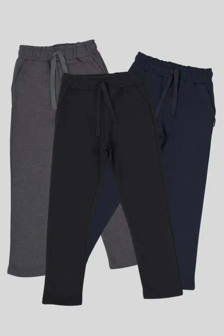 Lot de 3 bas de survêtement pour garçon, en coton épais, noir, bleu marine et anthracite, avec taille élastique et poche latérale.