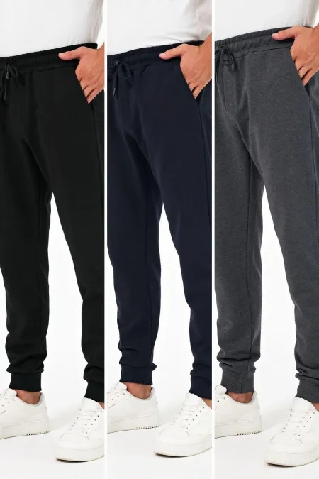 Lot de 3 pantalons de jogging épais pour homme (noir, marine et anthracite), avec poches arrière, chevilles élastiquées, coupe classique, sans armature.