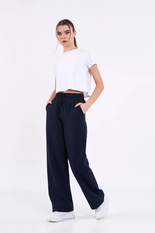 Pantalon de survêtement ample et confortable pour femme, idéal pour la saison, avec poches latérales, noir.