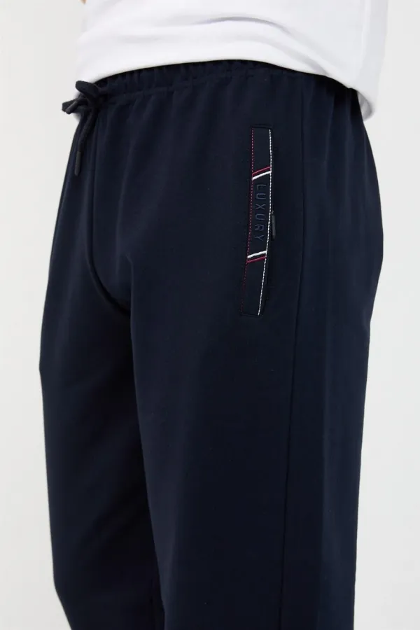 Men's Black and Navy Blue Sweatpants with Two Zipper Pockets, Embroidered Detail, Straight Leg, and Relaxed Fit.