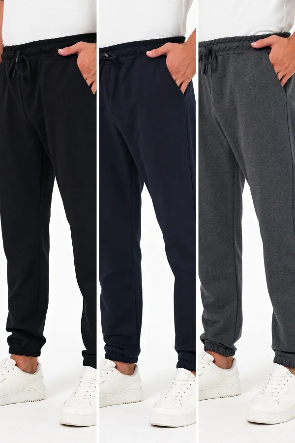 Lot de 3 pantalons de jogging épais pour homme (noir, marine et anthracite), avec poches arrière, chevilles élastiques, coupe classique, sans armature.