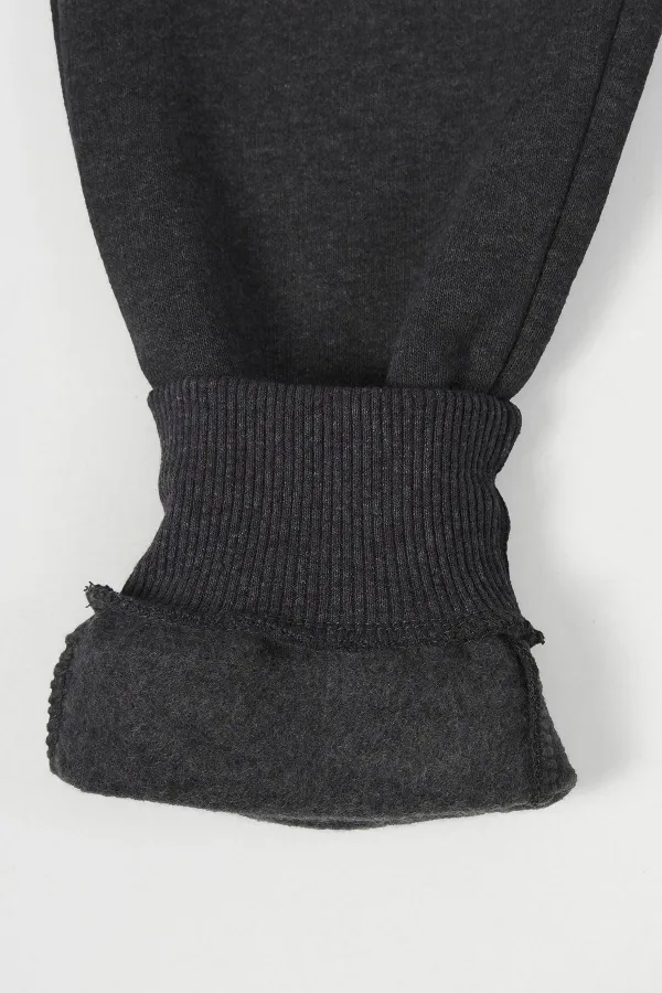 Pantalon de survêtement en coton épais anthracite avec taille et chevilles élastiques, pour filles de 5 à 12 ans.