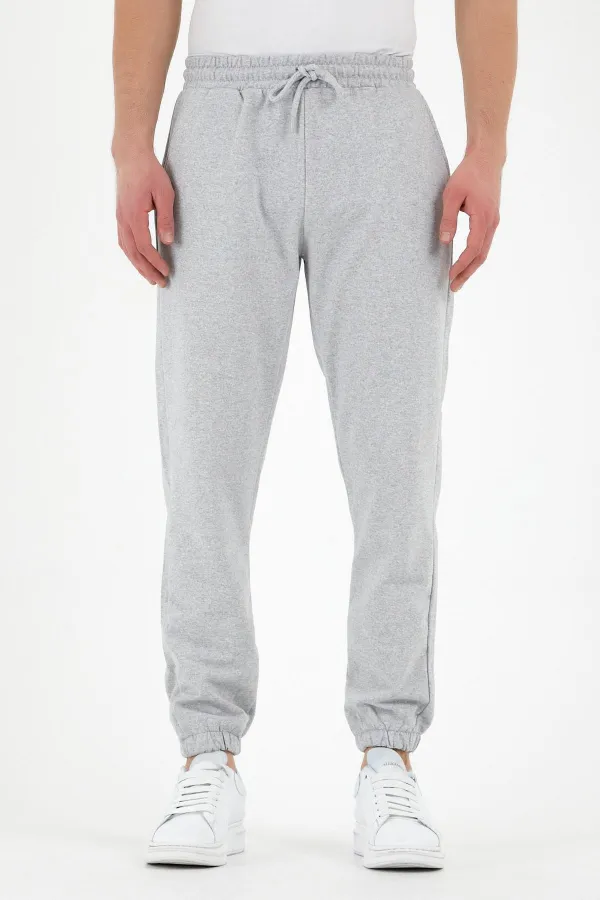 Pantalon de survêtement gris pour homme avec étiquette, poches arrière et latérales, coupe classique, taille élastique