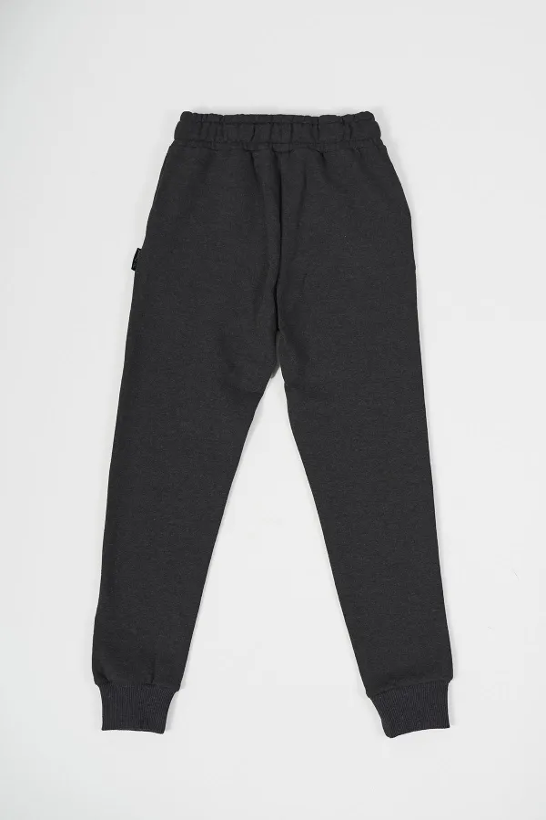 Pantalon de survêtement en coton épais anthracite avec taille et chevilles élastiques, pour filles de 5 à 12 ans.