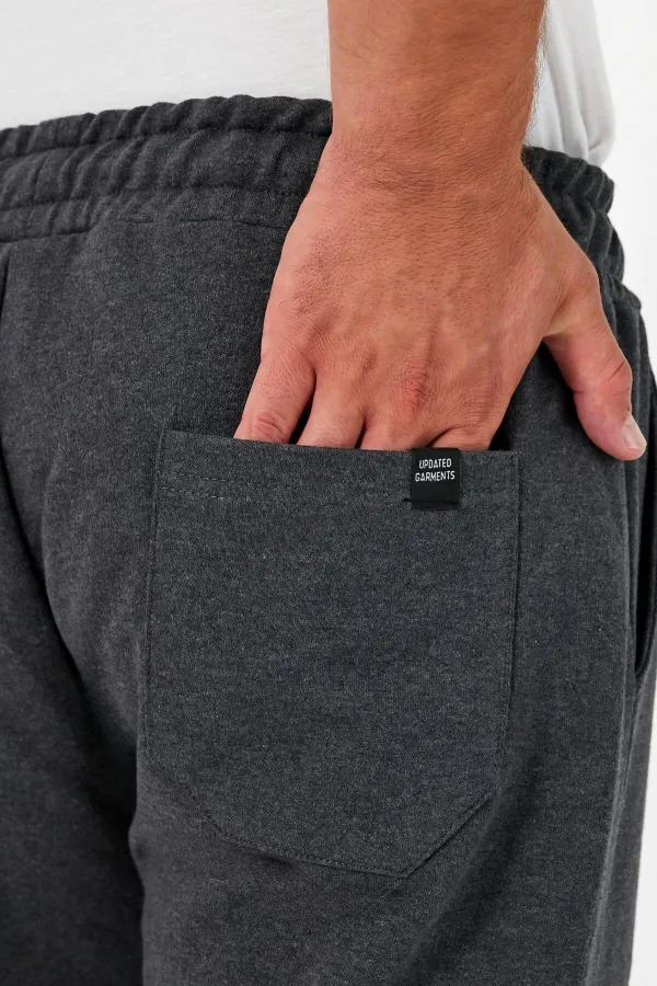 Pantalon de jogging épais anthracite pour homme, avec poches arrière, chevilles élastiques, coupe classique, sans armature.