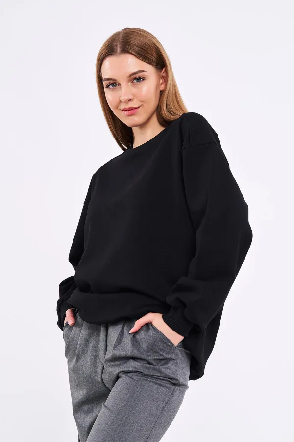 Sweat-shirt basique oversize en coton noir pour femme, col rond.
