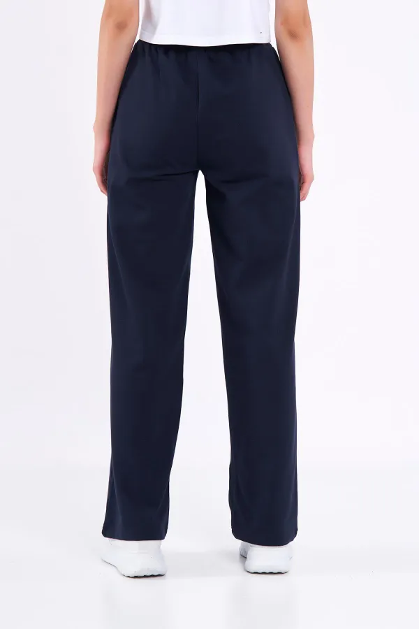 Pantalon de survêtement ample et confortable pour femme, idéal pour la saison, avec poches latérales, noir.