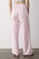 Pantalon rose à jambes larges et taille élastiquée
