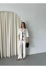 Ensemble chemisier et pantalon naturel à bordures noires