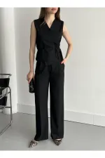 Ensemble gilet et pantalon noirs croisés
