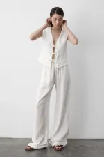 Ensemble gilet en mousseline blanche à 3 lacets